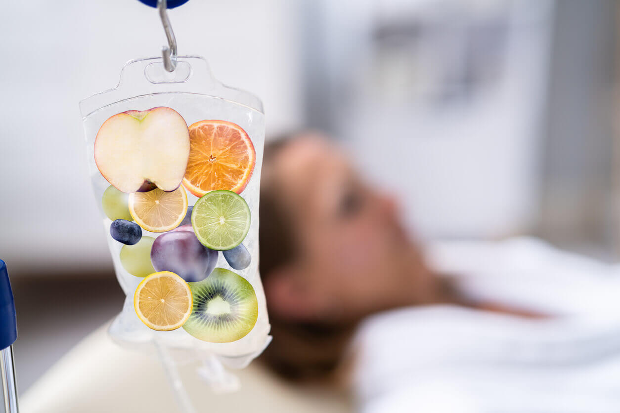 A blurred image of a woman taking IV Drip Vitamin Infuser Therapy Solution.